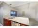 Granite countertop kitchen has stainless appliances with great natural light from large windows at 4471 Dean Martin Dr # 1207, Las Vegas, NV 89103