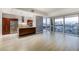 Modern kitchen featuring stainless steel appliances, granite countertops, and city views through large windows at 4471 Dean Martin Dr # 1207, Las Vegas, NV 89103