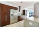 Contemporary kitchen with stainless steel fridge, granite countertops and wooden cabinets at 4471 Dean Martin Dr # 1207, Las Vegas, NV 89103