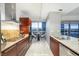 Stylish kitchen with modern appliances, granite countertops, and a dining nook with city views at 4471 Dean Martin Dr # 1207, Las Vegas, NV 89103