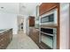 Well-equipped kitchen with stainless appliances and wooden cabinets, adjacent to the laundry area at 4471 Dean Martin Dr # 1207, Las Vegas, NV 89103