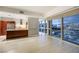 Modern living area with an open-concept kitchen and expansive windows offering city views at 4471 Dean Martin Dr # 1207, Las Vegas, NV 89103