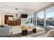 Modern living room with sleek furniture, open kitchen, and large windows with city views at 4471 Dean Martin Dr # 1207, Las Vegas, NV 89103