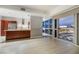 Clean, bright living space with an open layout, kitchen, and large windows overlooking the cityscape at 4471 Dean Martin Dr # 1207, Las Vegas, NV 89103