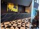 Luxurious lobby area with striking black and white geometric flooring, and a gold accent wall at 4471 Dean Martin Dr # 1207, Las Vegas, NV 89103