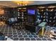 Sophisticated lounge with leather seating, fireplace, and full bookcases at 4471 Dean Martin Dr # 1207, Las Vegas, NV 89103