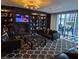 Upscale lounge with leather sofas, fireplace, bookshelves, and patterned rug at 4471 Dean Martin Dr # 1207, Las Vegas, NV 89103