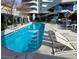 Upscale pool area with lounge chairs and modern architecture at 4471 Dean Martin Dr # 1207, Las Vegas, NV 89103