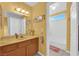 Bright bathroom with a marble countertop and updated lighting fixtures at 4655 Fire Fly Cir, Las Vegas, NV 89122