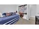 Bedroom with trundle bed, workspace, and carpet flooring at 4655 Fire Fly Cir, Las Vegas, NV 89122