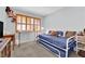 Bedroom featuring a trundle bed, bright windows, and neutral carpet at 4655 Fire Fly Cir, Las Vegas, NV 89122