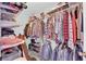 Walk-in closet featuring ample storage space, shelving, and organized clothing racks at 4655 Fire Fly Cir, Las Vegas, NV 89122