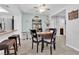 Cozy dining area with tile floors, a ceiling fan, and an adjacent kitchen space at 4655 Fire Fly Cir, Las Vegas, NV 89122