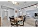 Charming dining area with a wood table and access to a living room with blue walls and lots of natural light at 4655 Fire Fly Cir, Las Vegas, NV 89122