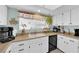 Well-lit kitchen with white cabinets, a window with valance, and countertop appliances at 4655 Fire Fly Cir, Las Vegas, NV 89122