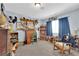 Cozy living room with neutral carpet, natural light, and vintage decor at 4655 Fire Fly Cir, Las Vegas, NV 89122