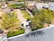 Aerial view showcasing a circular driveway, lush landscaping, and the inviting entrance of a luxury property at 5027 Crown Cypress St, Las Vegas, NV 89149