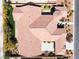 Expansive aerial view of a luxury property showcasing its unique roof design, landscaping, and outdoor living spaces at 5027 Crown Cypress St, Las Vegas, NV 89149