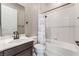 Bathroom with sink, toilet and shower/tub combo with updated black hardware at 5027 Crown Cypress St, Las Vegas, NV 89149