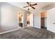 Comfortable bedroom with a ceiling fan, closet, and bathroom access at 5027 Crown Cypress St, Las Vegas, NV 89149