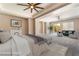Staged main bedroom area showcasing a spacious sitting area and plenty of natural light at 5027 Crown Cypress St, Las Vegas, NV 89149