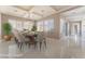Staged dining room featuring recessed lights, with a formal table and 8 chairs at 5027 Crown Cypress St, Las Vegas, NV 89149