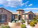 Stunning single-Gathering home with a beautiful stone facade, turret entry, and meticulously landscaped front yard at 5027 Crown Cypress St, Las Vegas, NV 89149