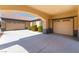 Attached three-car garage with ample parking space, showcasing a well-maintained driveway and attractive curb appeal at 5027 Crown Cypress St, Las Vegas, NV 89149