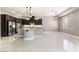 Open kitchen with stainless steel appliances, granite countertops, and modern island at 5027 Crown Cypress St, Las Vegas, NV 89149