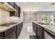 Well-equipped kitchen showcasing granite countertops, a gas cooktop, and stainless steel appliances at 5027 Crown Cypress St, Las Vegas, NV 89149