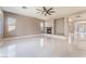 Expansive living room featuring modern tile flooring, recessed lighting, and a cozy fireplace at 5027 Crown Cypress St, Las Vegas, NV 89149