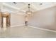 Bright living room with coffered ceilings, recessed lighting, and tile floors at 5027 Crown Cypress St, Las Vegas, NV 89149