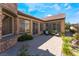 Charming backyard patio with stone flooring, cozy seating, and well-maintained landscaping, perfect for outdoor relaxation at 5027 Crown Cypress St, Las Vegas, NV 89149