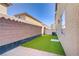 Artificial grass and a secure fence define the outdoor area, creating a private and serene atmosphere at 5948 Sakhalin Ave, Las Vegas, NV 89139