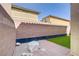 Low-maintenance backyard with artificial grass and paved patio, perfect for outdoor entertaining at 5948 Sakhalin Ave, Las Vegas, NV 89139