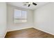 Cozy bedroom with natural light streaming through the window, illuminating the hardwood floors at 5948 Sakhalin Ave, Las Vegas, NV 89139