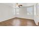 Unfurnished bedroom features a ceiling fan, wood floors, and neutral walls at 5948 Sakhalin Ave, Las Vegas, NV 89139