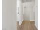 Hallway leading to a laundry room with upper level access at 5948 Sakhalin Ave, Las Vegas, NV 89139