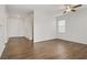 Open floorplan living room featuring beautiful hardwood floors and neutral paint at 5948 Sakhalin Ave, Las Vegas, NV 89139