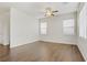 Open floorplan living room area featuring beautiful hardwood floors and lots of natural light at 5948 Sakhalin Ave, Las Vegas, NV 89139