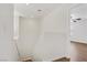 Bright staircase landing with wood floors and white walls leading to an upstairs room at 5948 Sakhalin Ave, Las Vegas, NV 89139