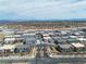 Expansive aerial view showcasing the residential community with mountain views in the distance at 600 N Carriage Hill Dr # 1164, Las Vegas, NV 89138