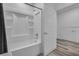 Well-lit bathroom features a shower-tub combo and access to storage at 600 N Carriage Hill Dr # 1164, Las Vegas, NV 89138