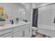 Bathroom showcasing a vanity, shower with a glass door, and a tub at 600 N Carriage Hill Dr # 1164, Las Vegas, NV 89138