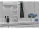 Bright bathroom with a large mirror, modern fixtures, and a shower with sleek black shower curtain at 600 N Carriage Hill Dr # 1164, Las Vegas, NV 89138