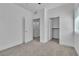 This carpeted bedroom offers easy access to both the closet and bathroom at 600 N Carriage Hill Dr # 1164, Las Vegas, NV 89138