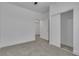 This bedroom features a ceiling fan, carpet, and a convenient closet for storage at 600 N Carriage Hill Dr # 1164, Las Vegas, NV 89138