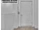 Hallway features a door to a personal in-home private elevator for easy accessibility at 600 N Carriage Hill Dr # 1164, Las Vegas, NV 89138