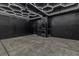 Spacious garage with modern lighting, laundry and sleek black door at 600 N Carriage Hill Dr # 1164, Las Vegas, NV 89138