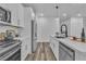 Bright kitchen with white cabinets, stainless steel appliances, and durable flooring at 600 N Carriage Hill Dr # 1164, Las Vegas, NV 89138